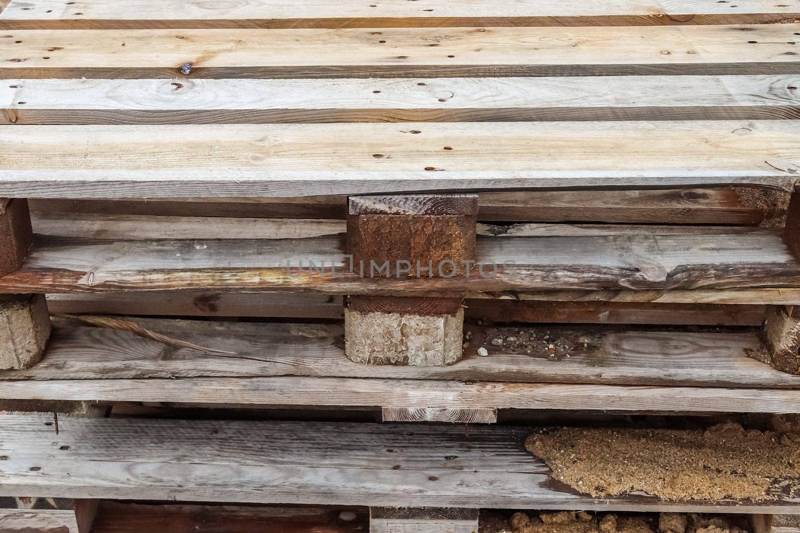 Close up view of a stack of wooden pallets. by MP_foto71