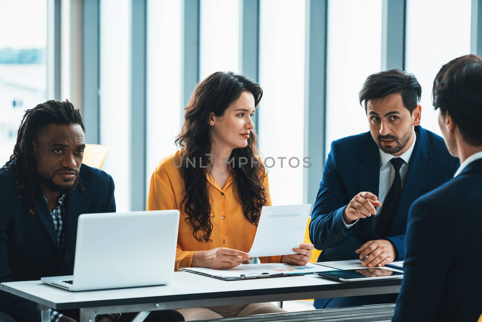 Diversity recruiters interview candidate at the bright office. A group of human resources professionals explaining an applicant for a new position. asking interviewee a question. Intellectual.