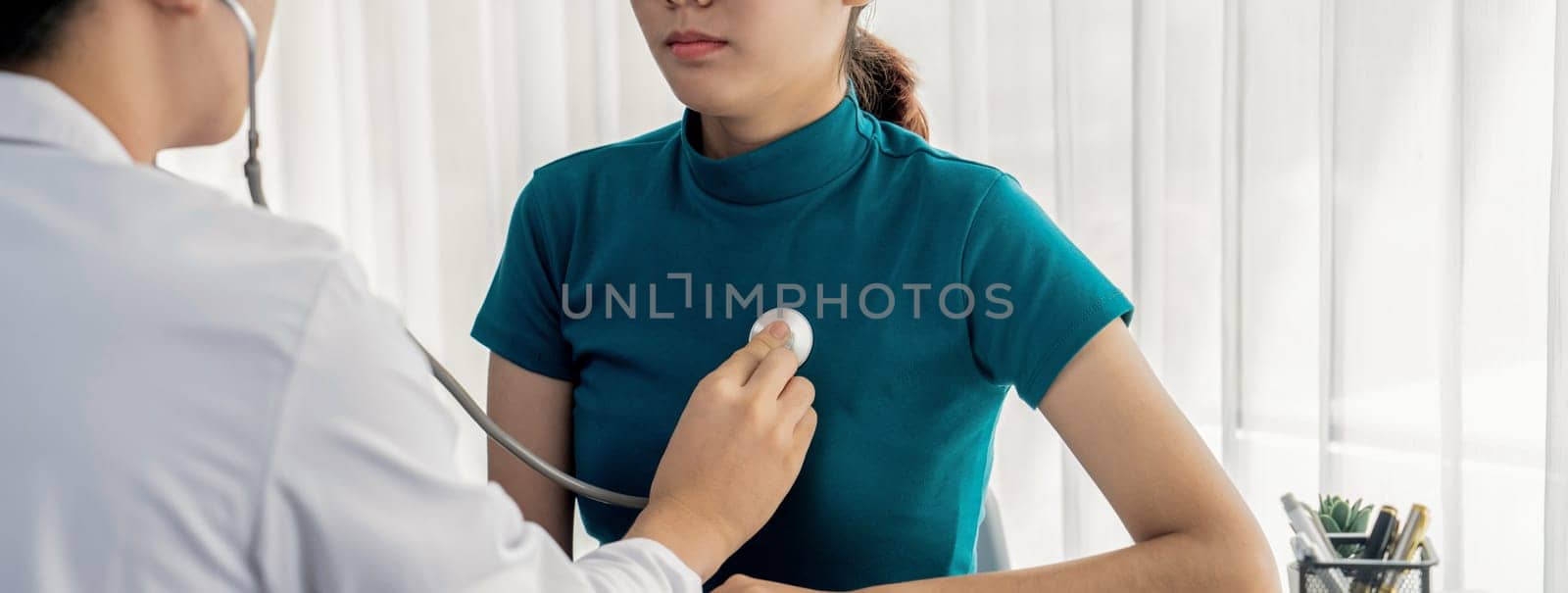 Doctor check patients's pulse with stethoscope in hospital. Rigid by biancoblue
