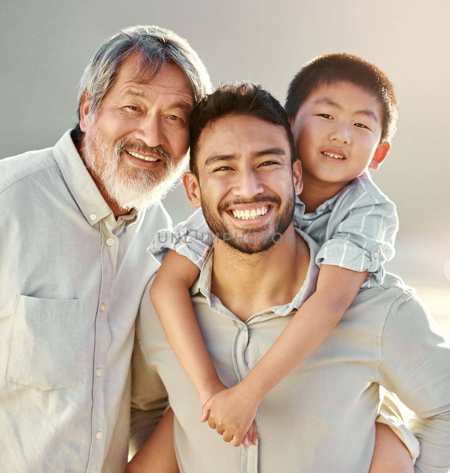 The men in our family. Cropped portrait of a handsome young man on the beach with his father and son. by YuriArcurs