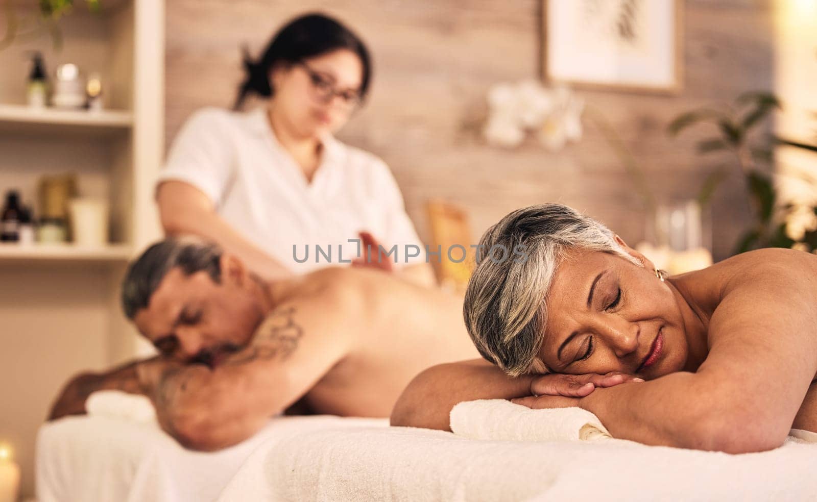 Relax, senior and a couple at the massage salon together for peace, wellness or bonding. Luxury, beauty or body care with an old woman and man in a spa for physical therapy or treatment at a resort.