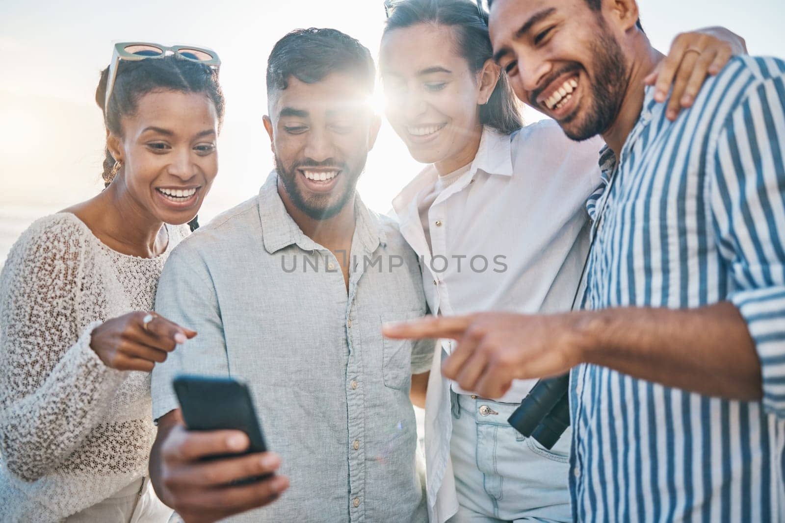 Outdoor, friends and social media with smile in the sun happy with phone and meme laugh. Young people, together and mobile connection with video watching and live streaming with internet and web app.