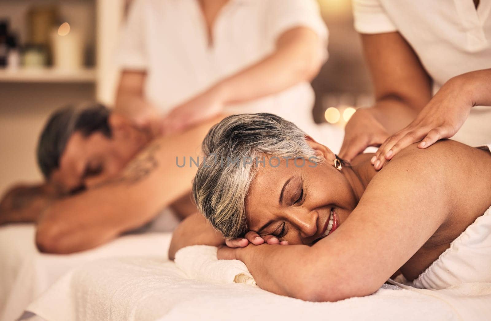 Relax, retirement and a couple at the spa for a massage together for peace, wellness or bonding. Luxury, hospitality or body care with a senior woman and man in a beauty salon for physical therapy by YuriArcurs