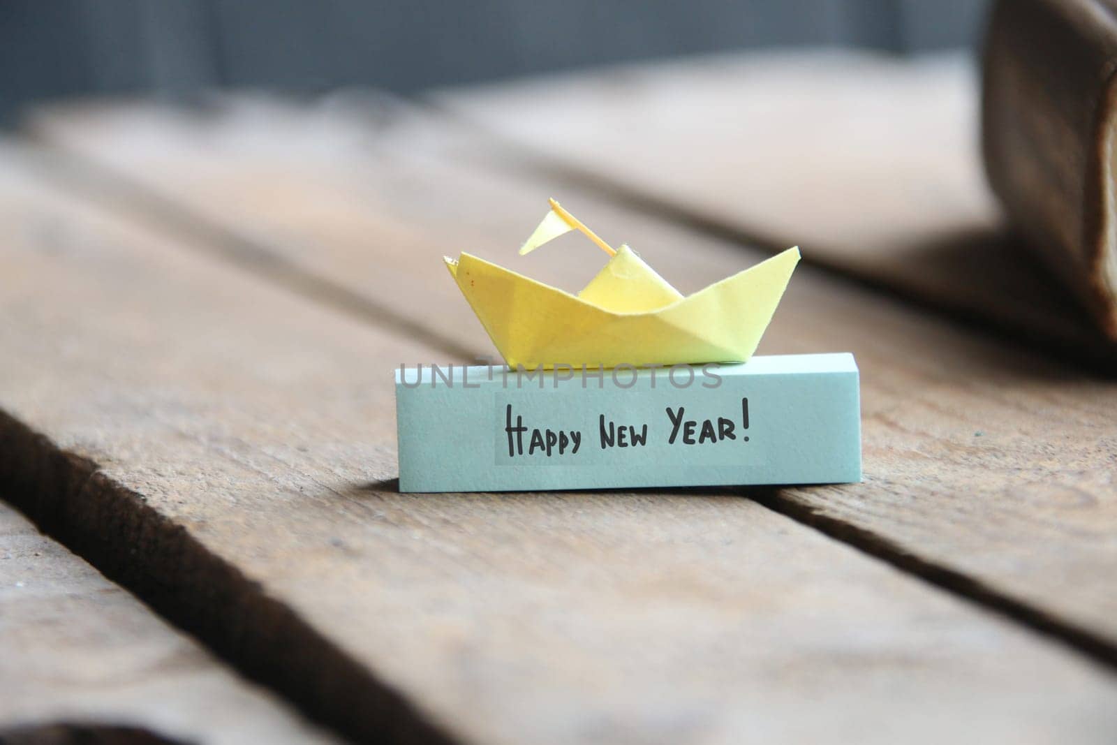 Happy New year concept. Paper ship and tag.