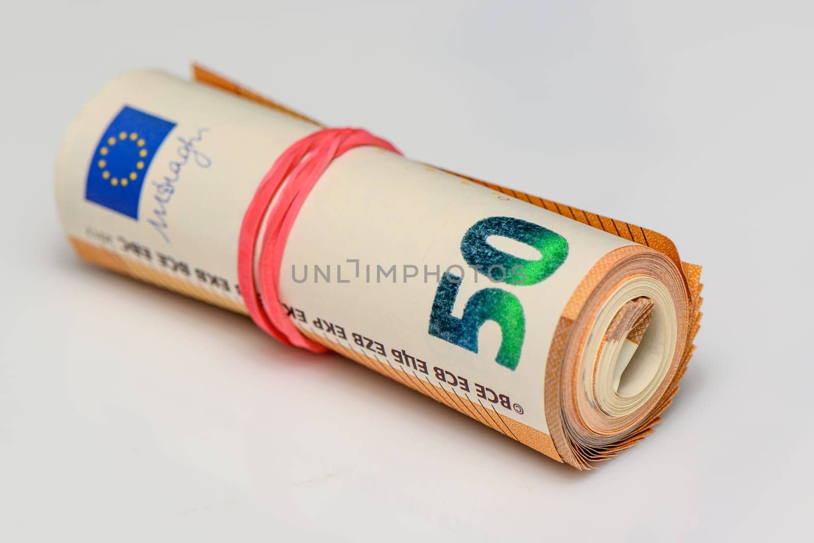 50 euro bills on white background rolled into a tube 9 by Mixa74