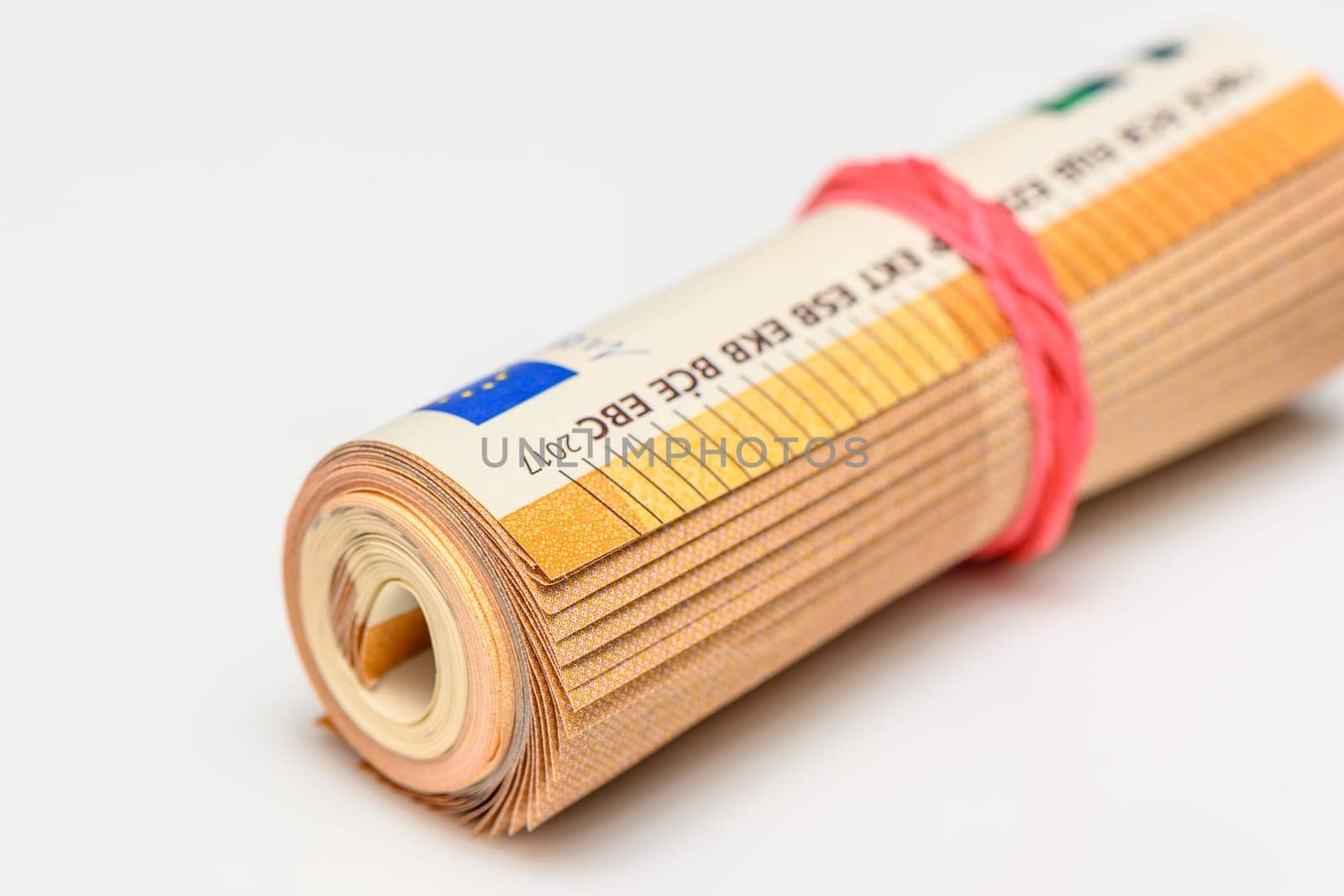 50 euro bills on white background rolled into a tube by Mixa74