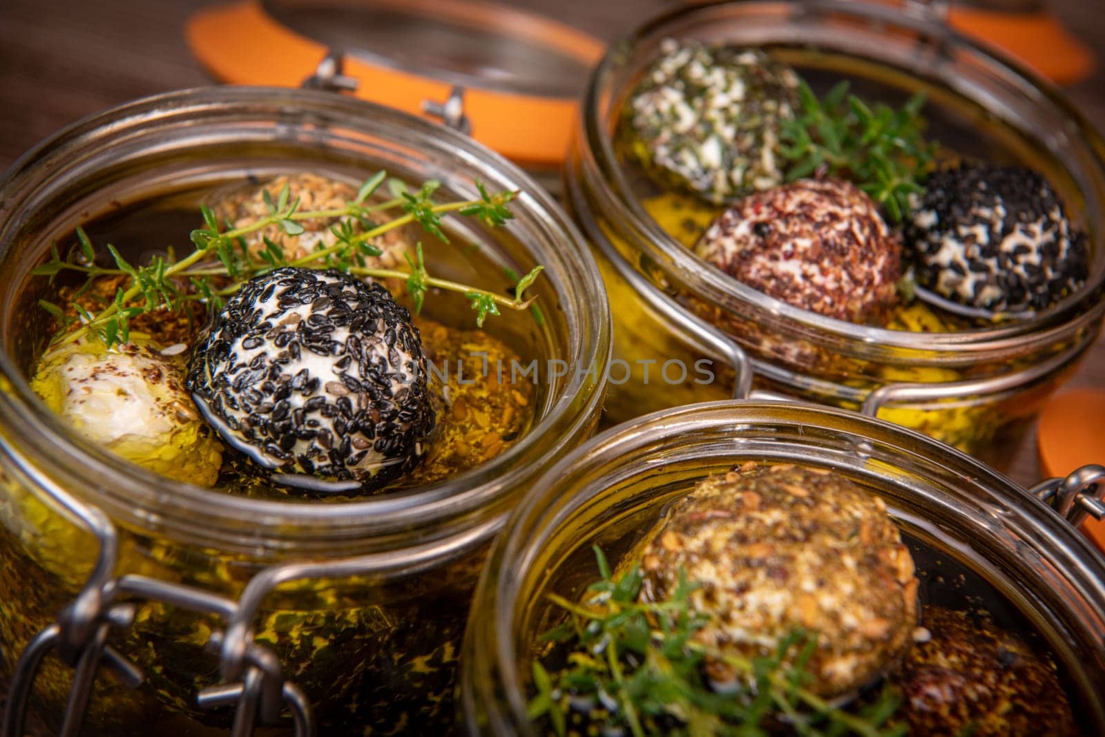 RECIPE FOR LABNEH CHEESE BOLLS WITH DRY MINT, BLACK AND WHITE SESAME, SUMAC AND ZAATAR IN A JAR WITH OLIVE OIL. High quality photo