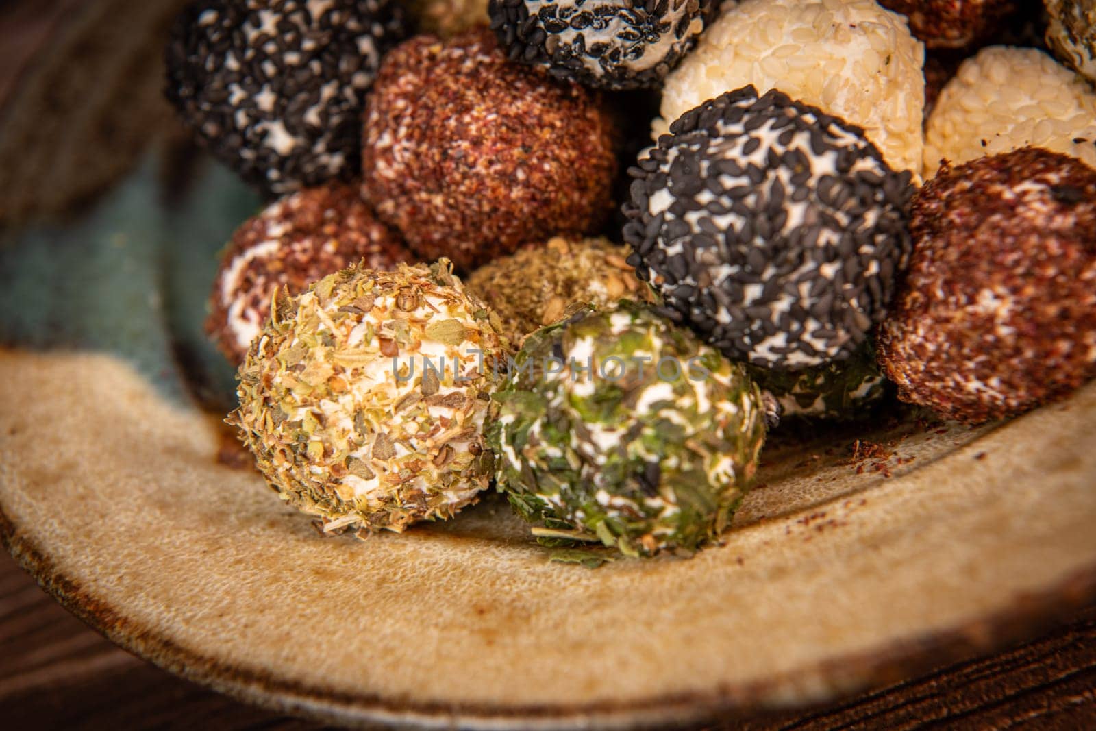 RECIPE FOR LABNEH CHEESE BOLLS WITH DRIED MINT, WHITE AND BLACK SESAME, SUMAC AND ZAATAR. High quality photo