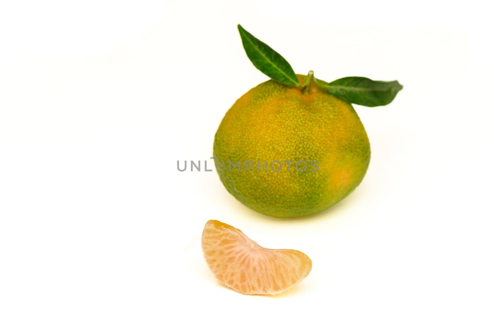 delicious fresh green-orange tangerines on a white background 2