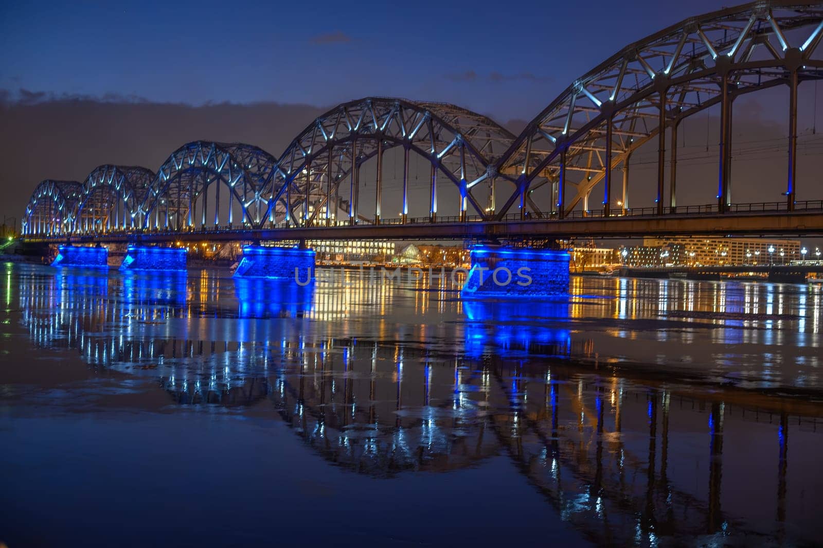 railway bridge in Riga on a winter evening