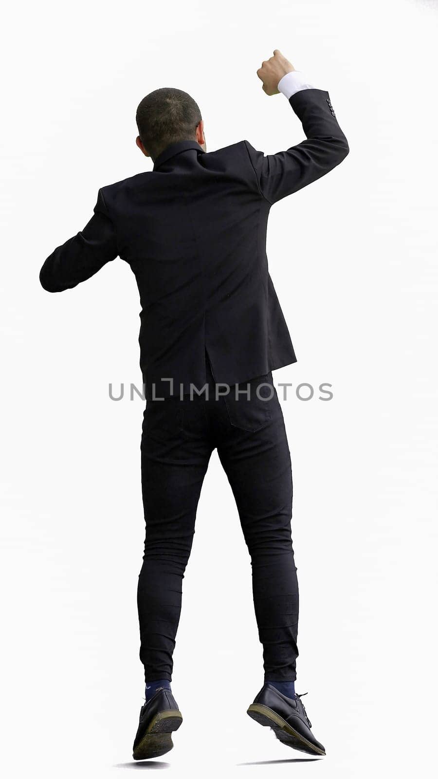 man in full growth. isolated on white background jumping rejoices.