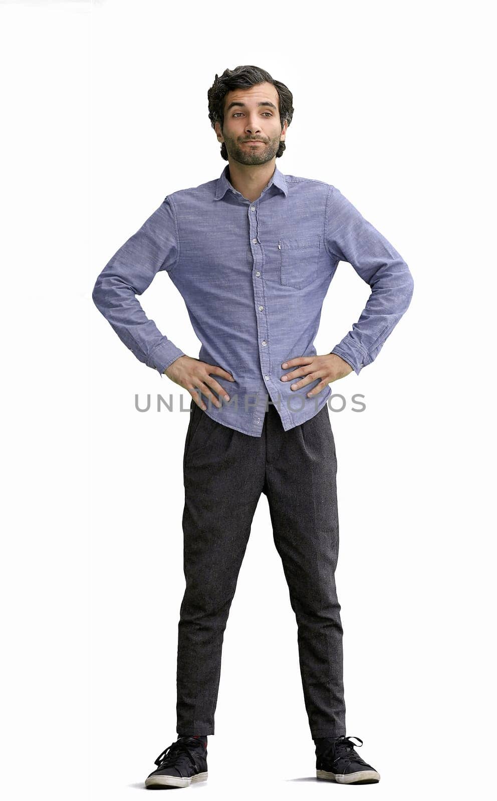 full-length portrait of a young man. standing isolated on white background.