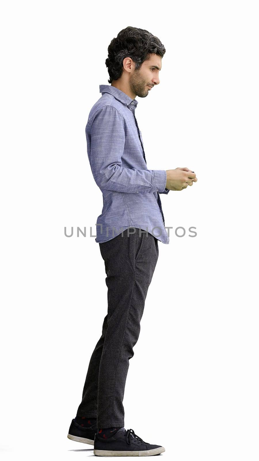 young man in full growth. isolated on white background taking selfie by Prosto