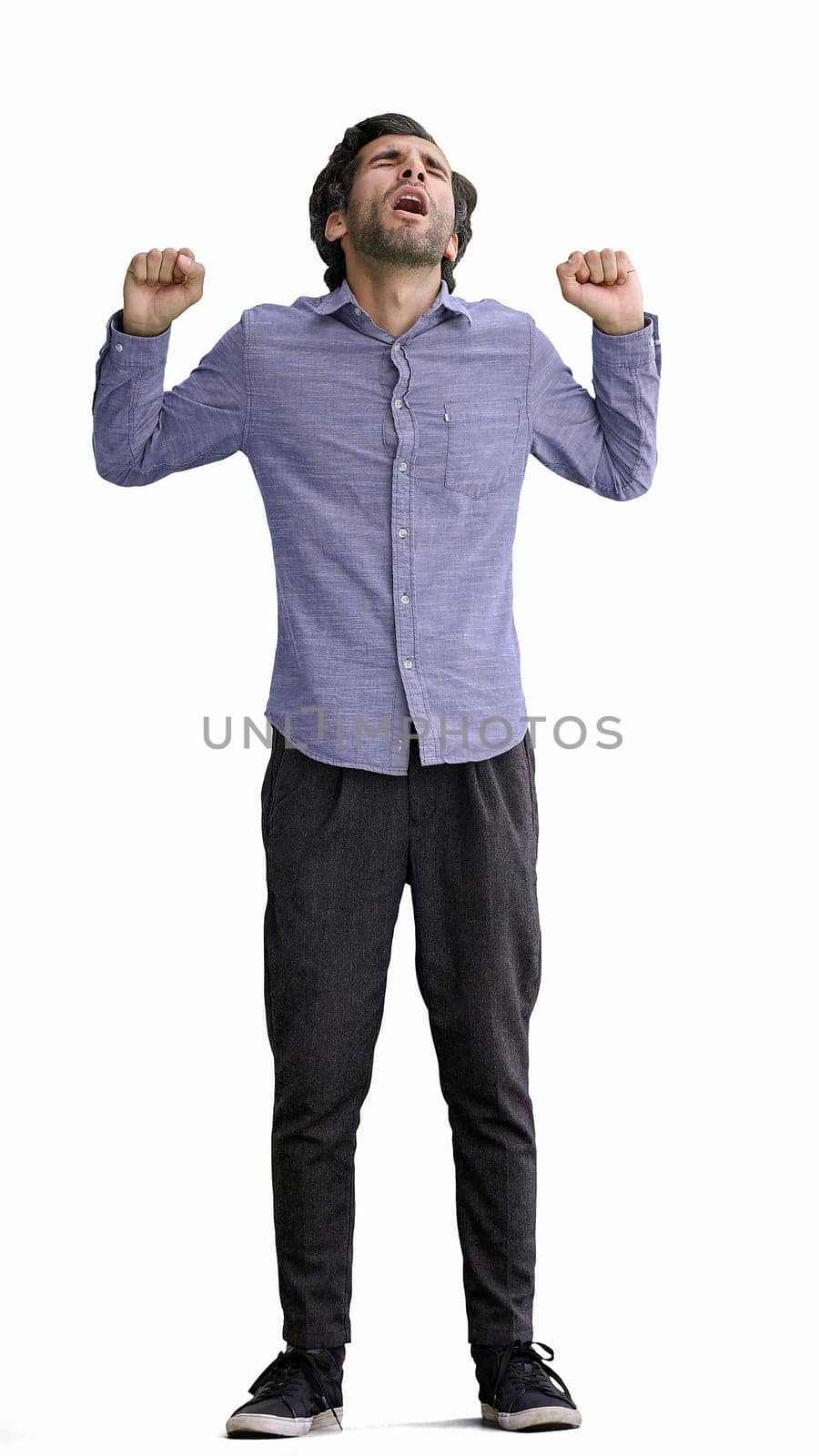 man in full growth. isolated on white background sleepy stretches.