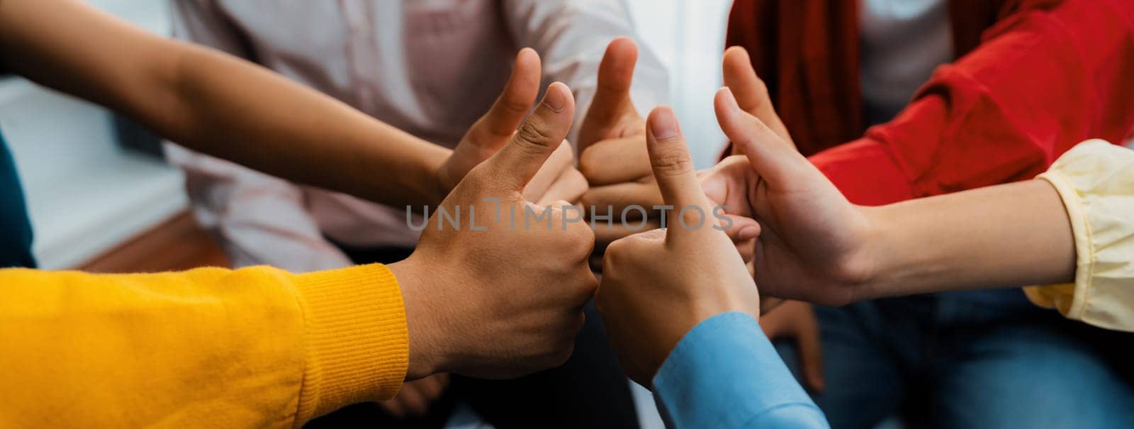 Startup company employee team stacking hand together symbolize successful group of business partnership and strong collective unity teamwork in community workplace in panoramic banner. Synergic