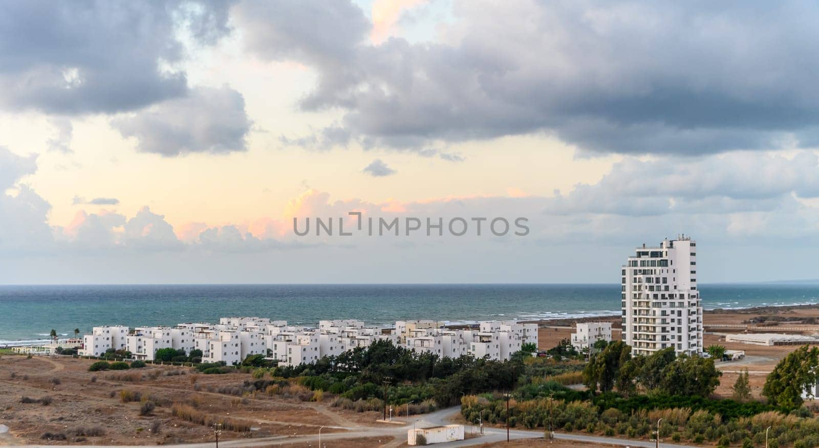 bird's eye view of a residential complex near the sea by Mixa74