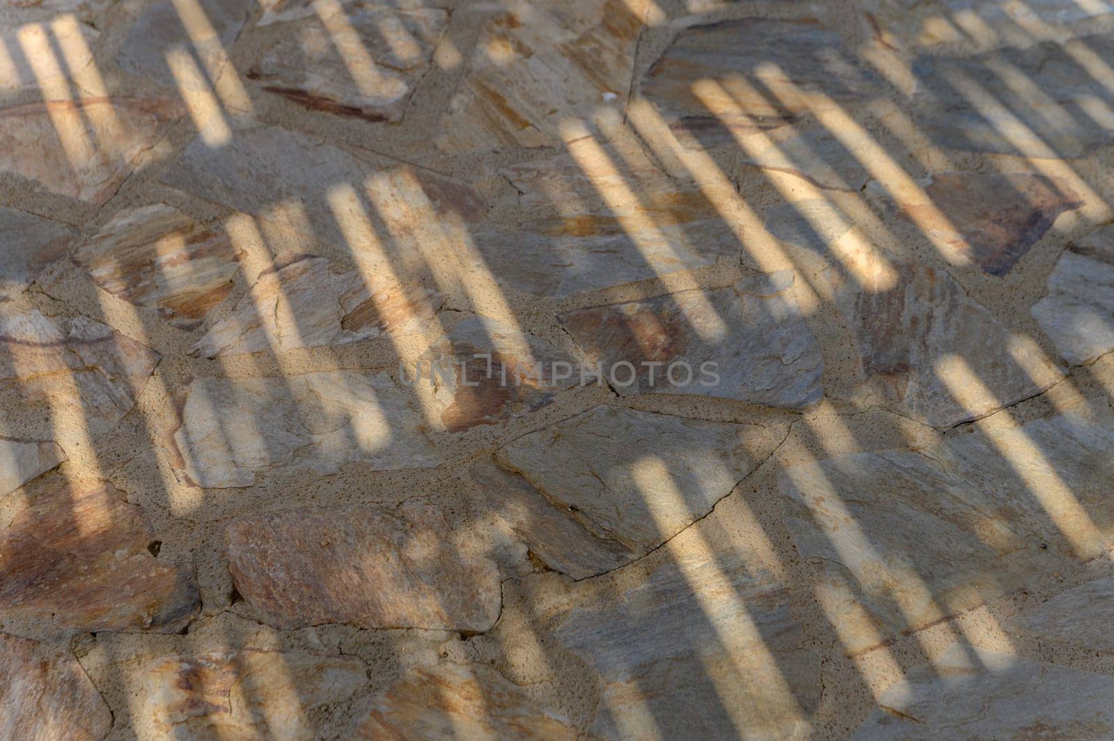 the sun shines through the thatched roof onto the stone floor, shadow and light 1