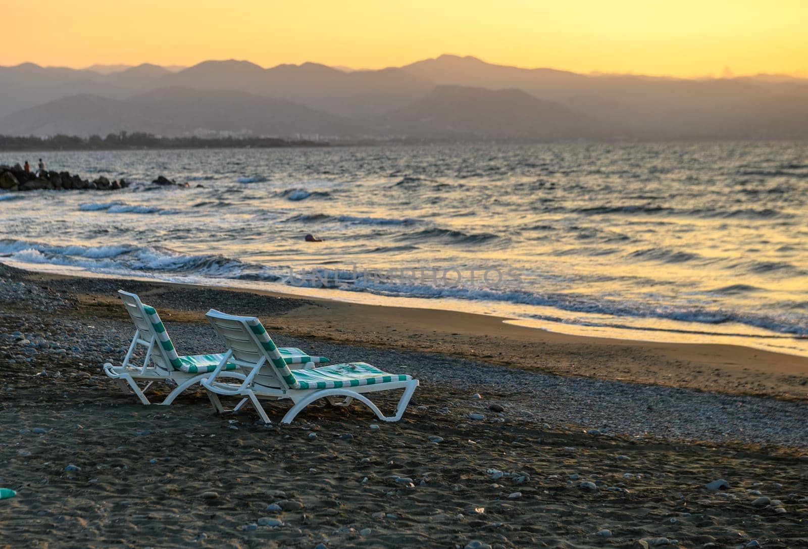 sunbeds in the sea on a Mediterranean beach