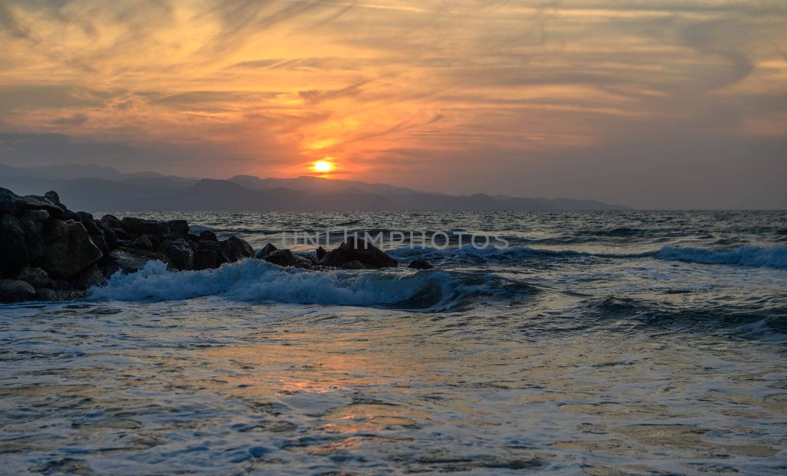 shore of the Mediterranean sea autumn 2023 in the setting sun 10