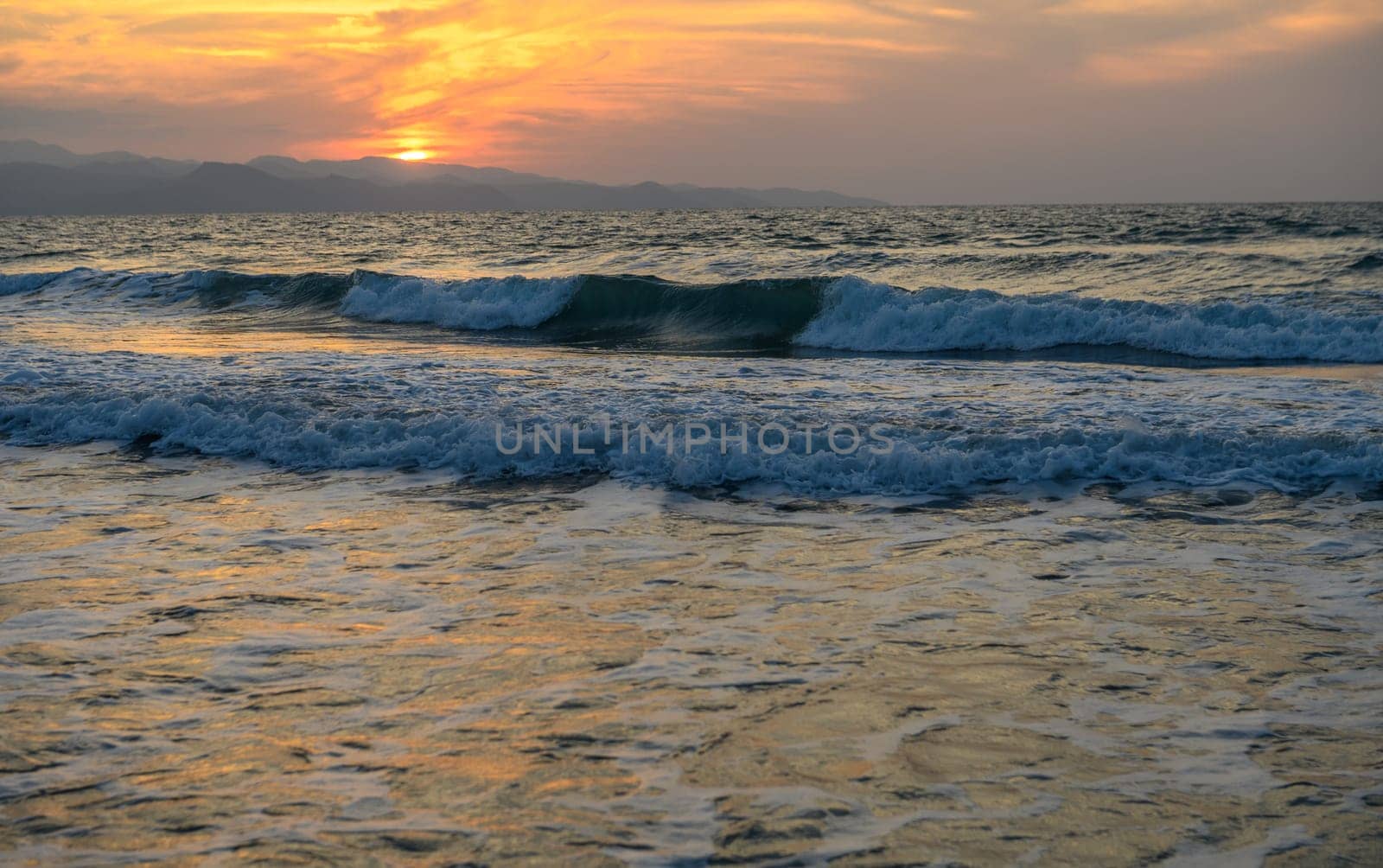 Mediterranean sunset in autumn 2023, beach in the evening