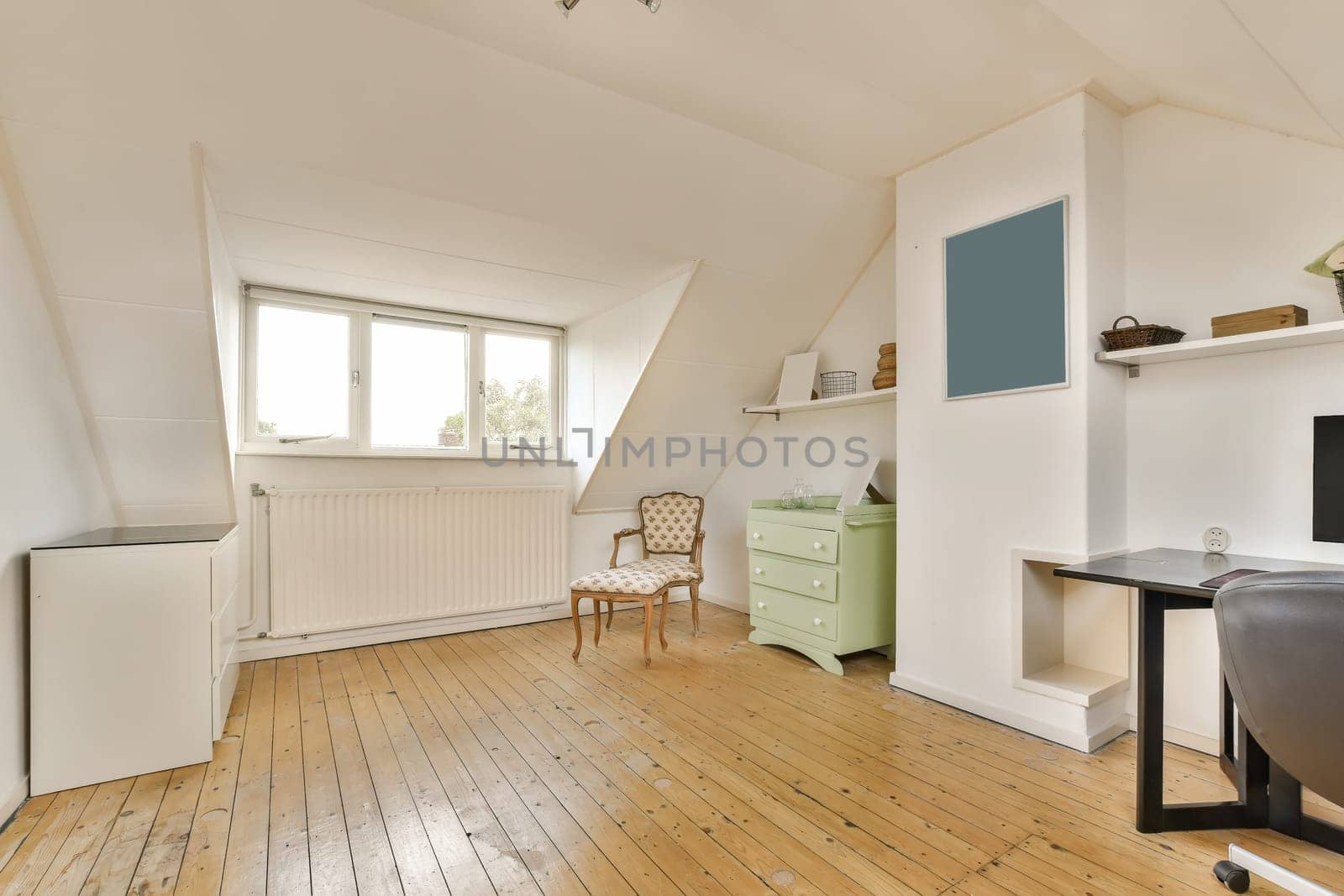 a living room with white walls and a wooden floor by casamedia