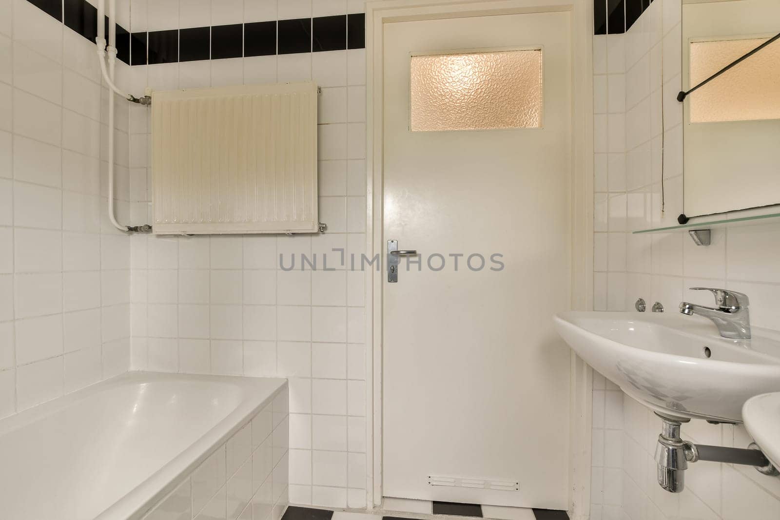 a small bathroom with a sink and a bath tub by casamedia