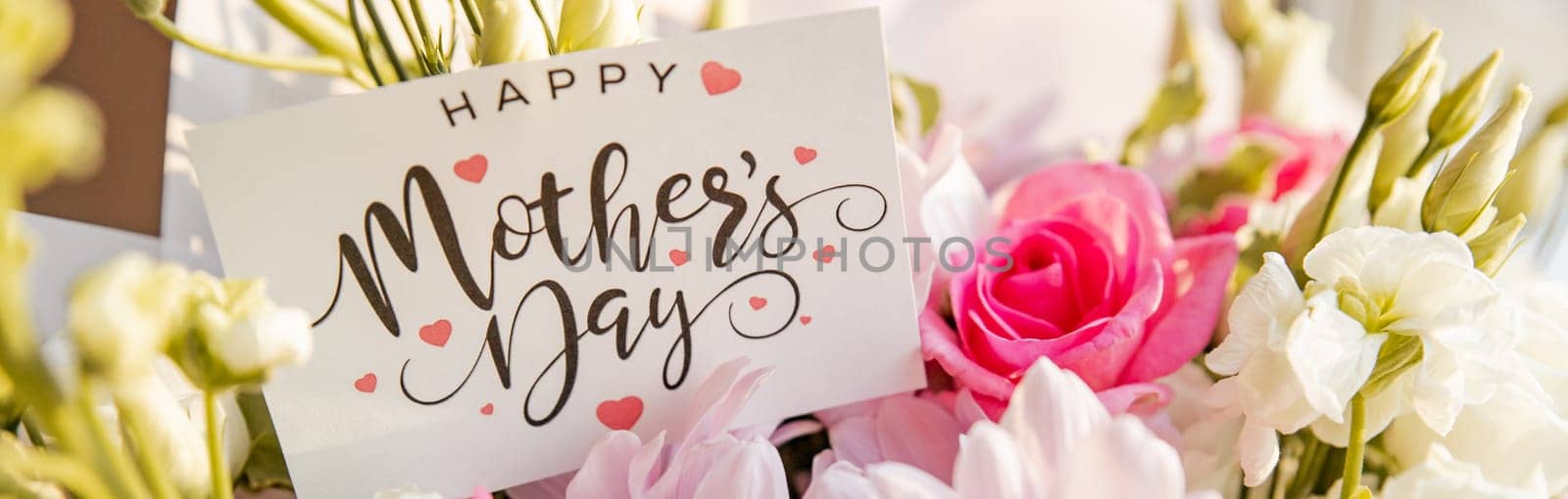 flower composition of light roses and eustoma closeup. Text Happy mother's day