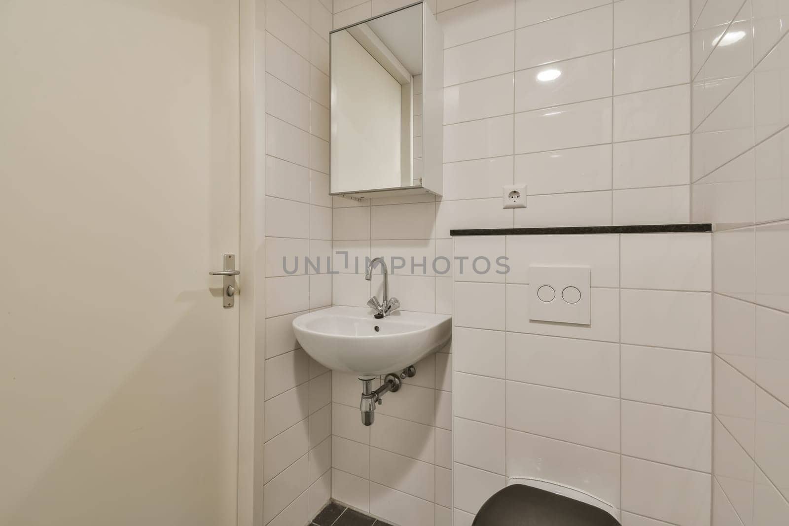 a small bathroom with a sink and a toilet by casamedia