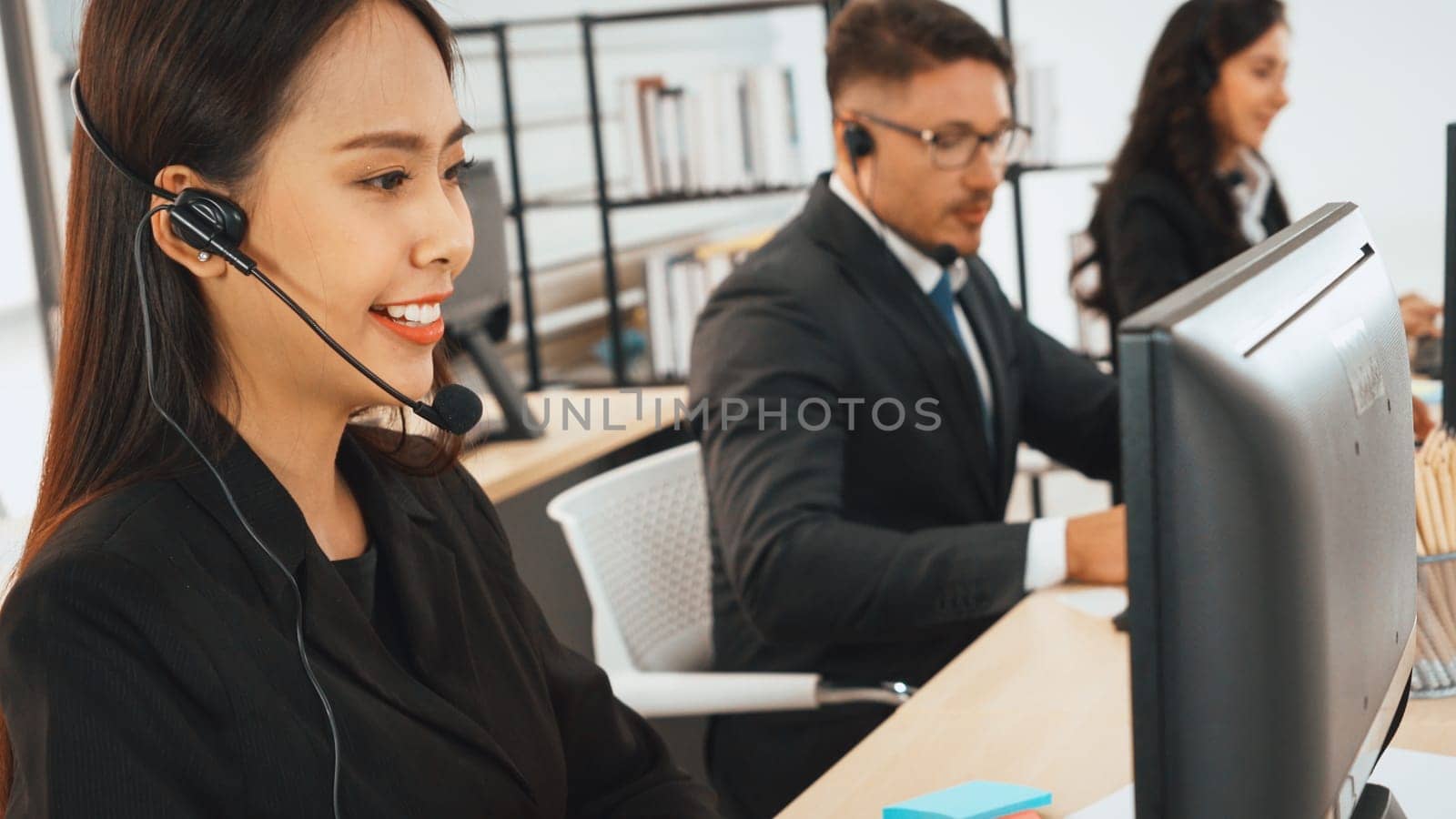 Business people wearing headset working in office Jivy by biancoblue