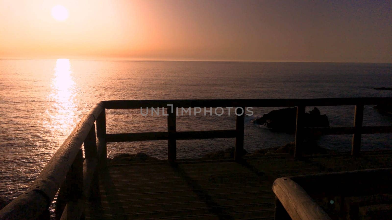 Sunset view from the wooden walkway on Carrapateira, District Aljezur, Algarve Portugal