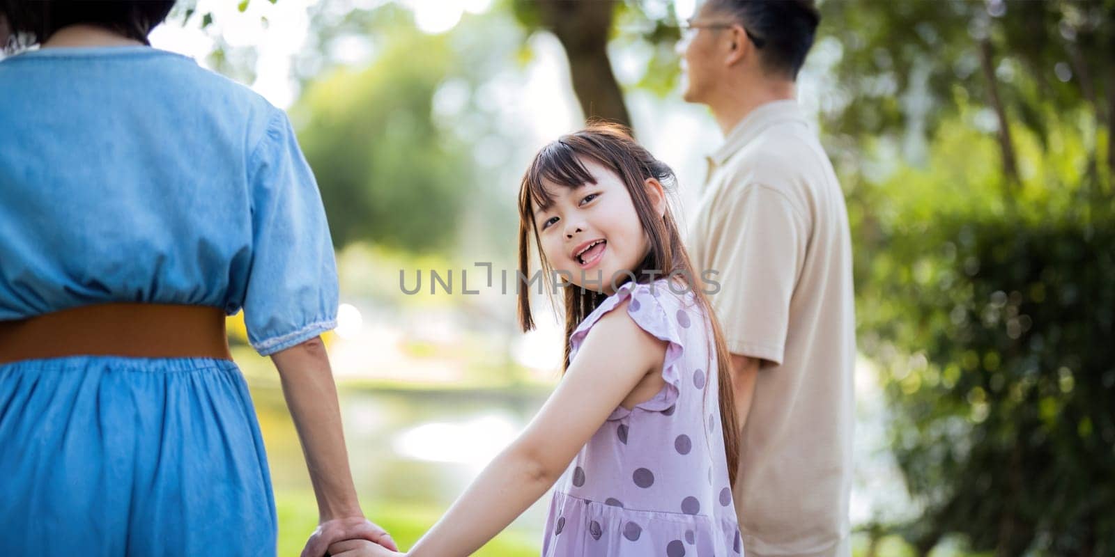 Grandparent playing togetherness with a granddaughter in the park in the morning. Family, love and grandchild bonding with grandfather and grandma in a park. concept child and senior.