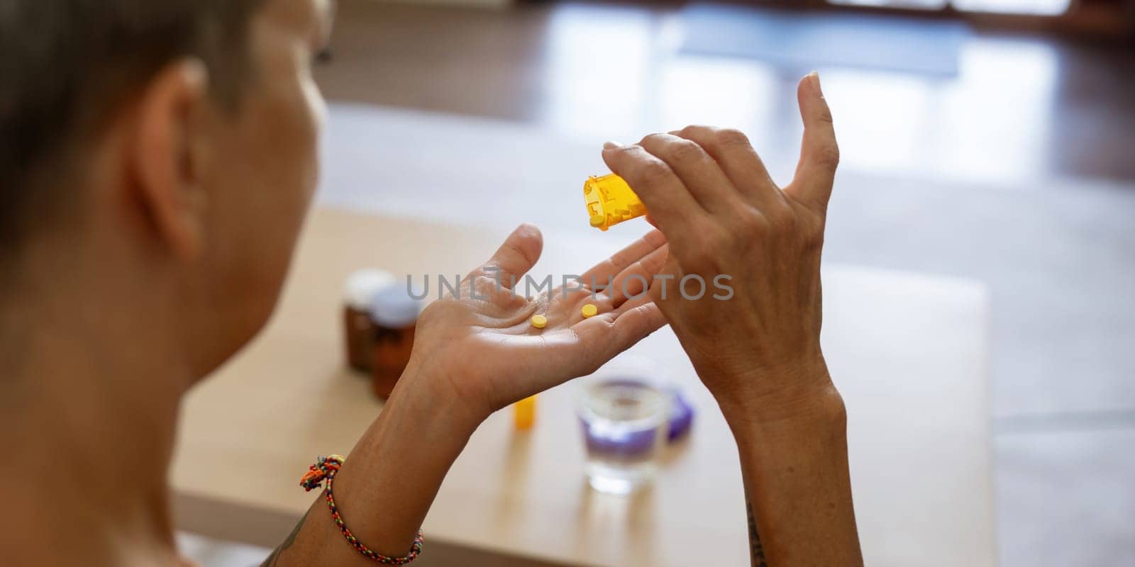 Medicine and healthcare of senior woman taking daily pill for ill, medication and sick elderly with medical drugs, vitamin or supplement in his hand.