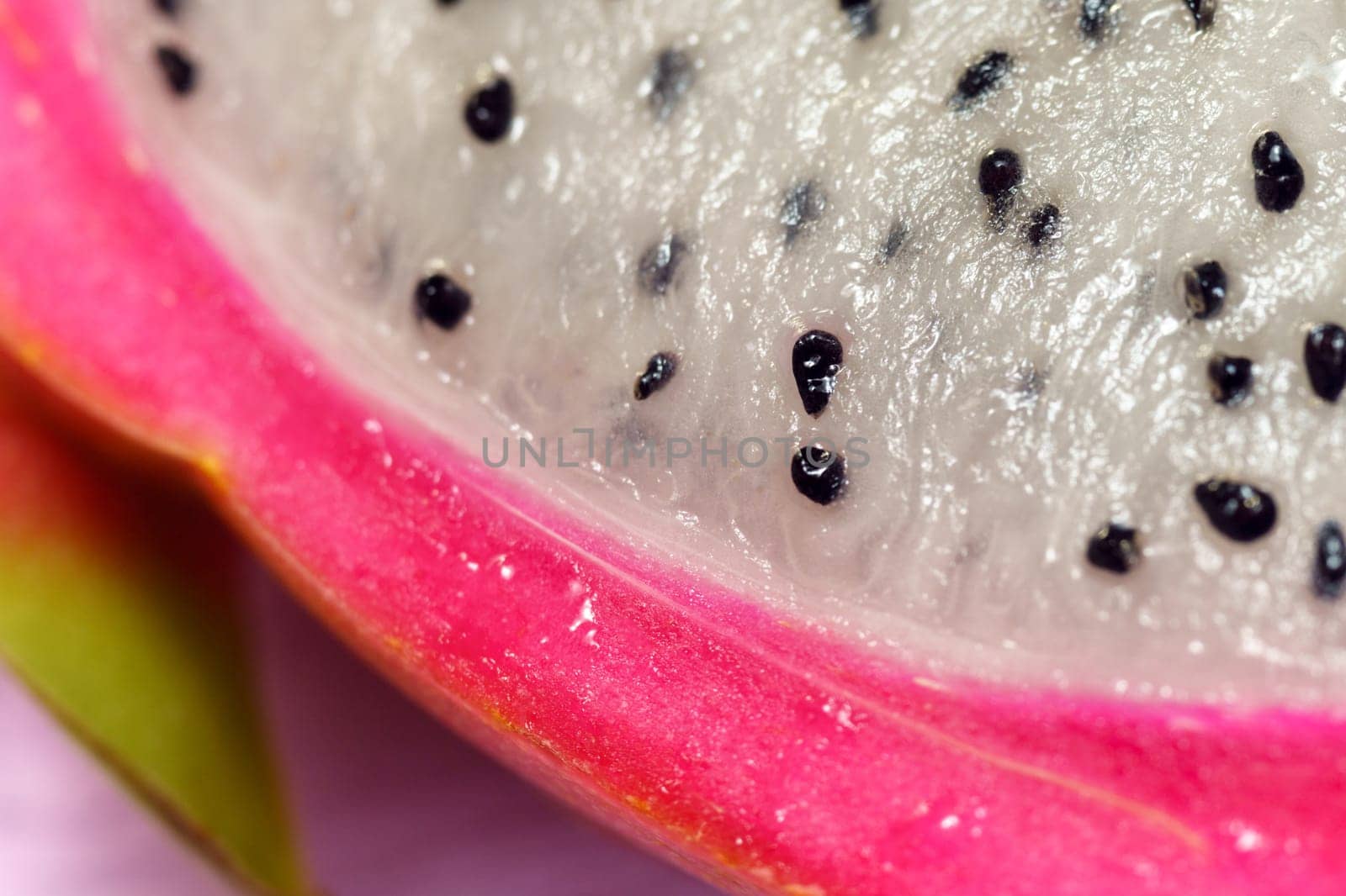 Organic dragon fruit on a pink background, creative summer food concept. Macro by darksoul72