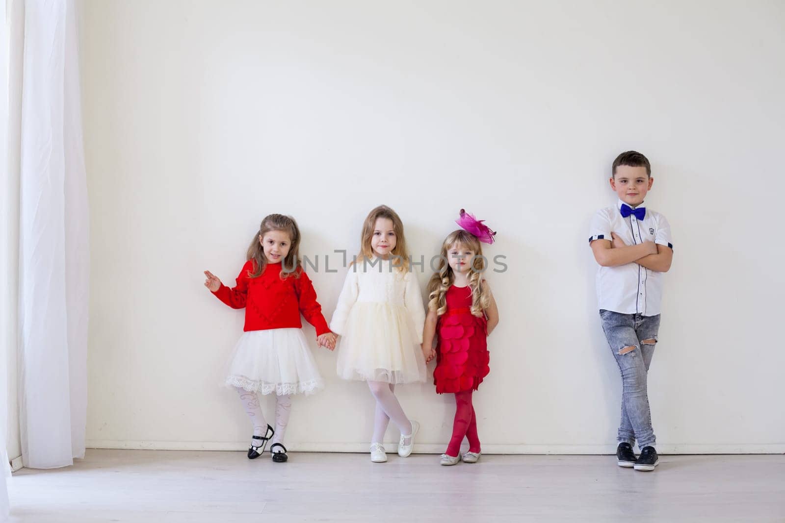 four children standing in a bright holiday room by Simakov