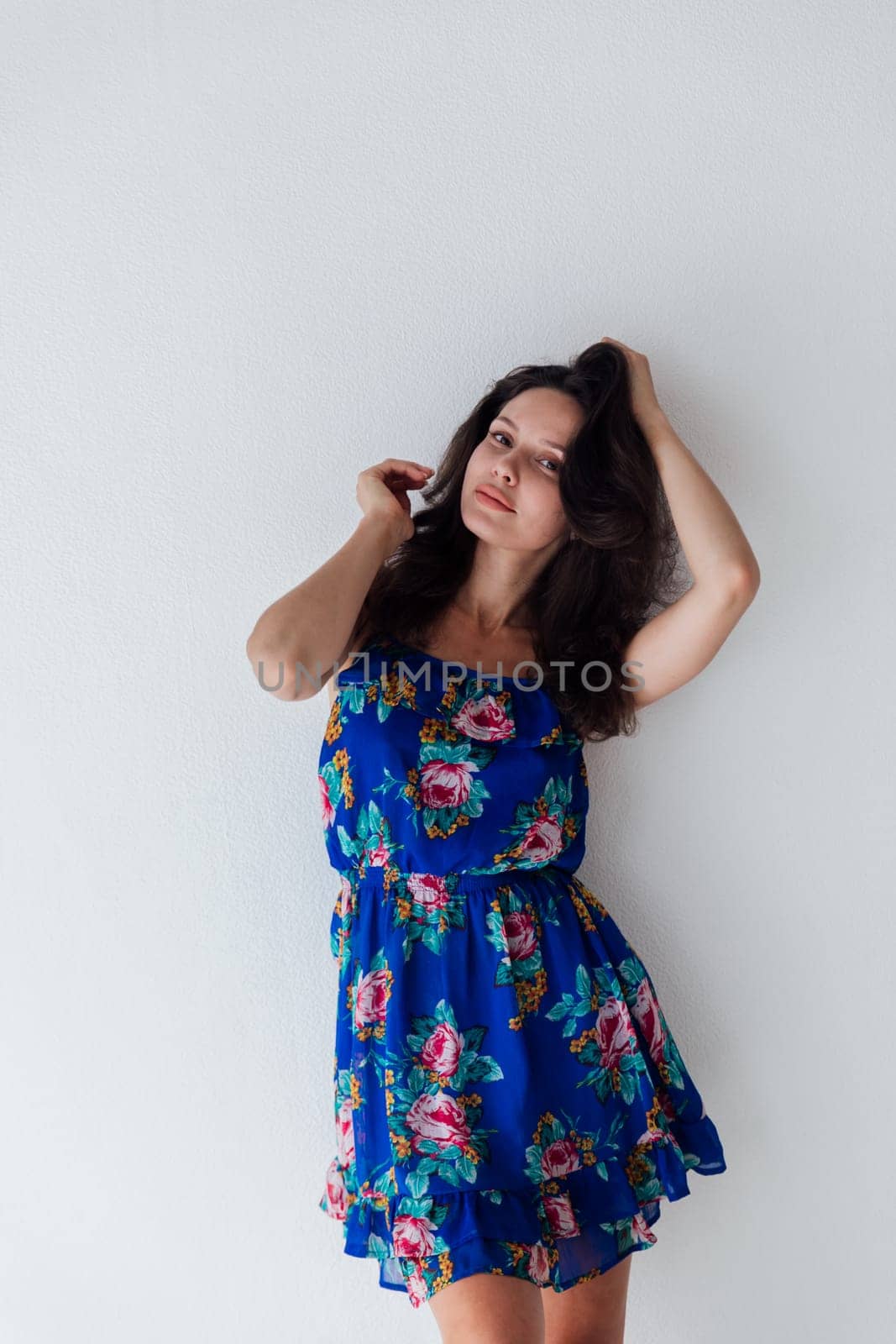 beautiful woman in a blue floral dress on a white background by Simakov