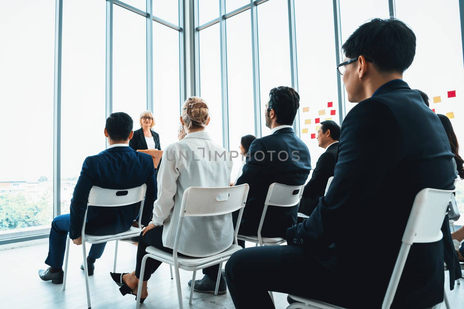 Group of business people meeting in a seminar conference Jivy by biancoblue