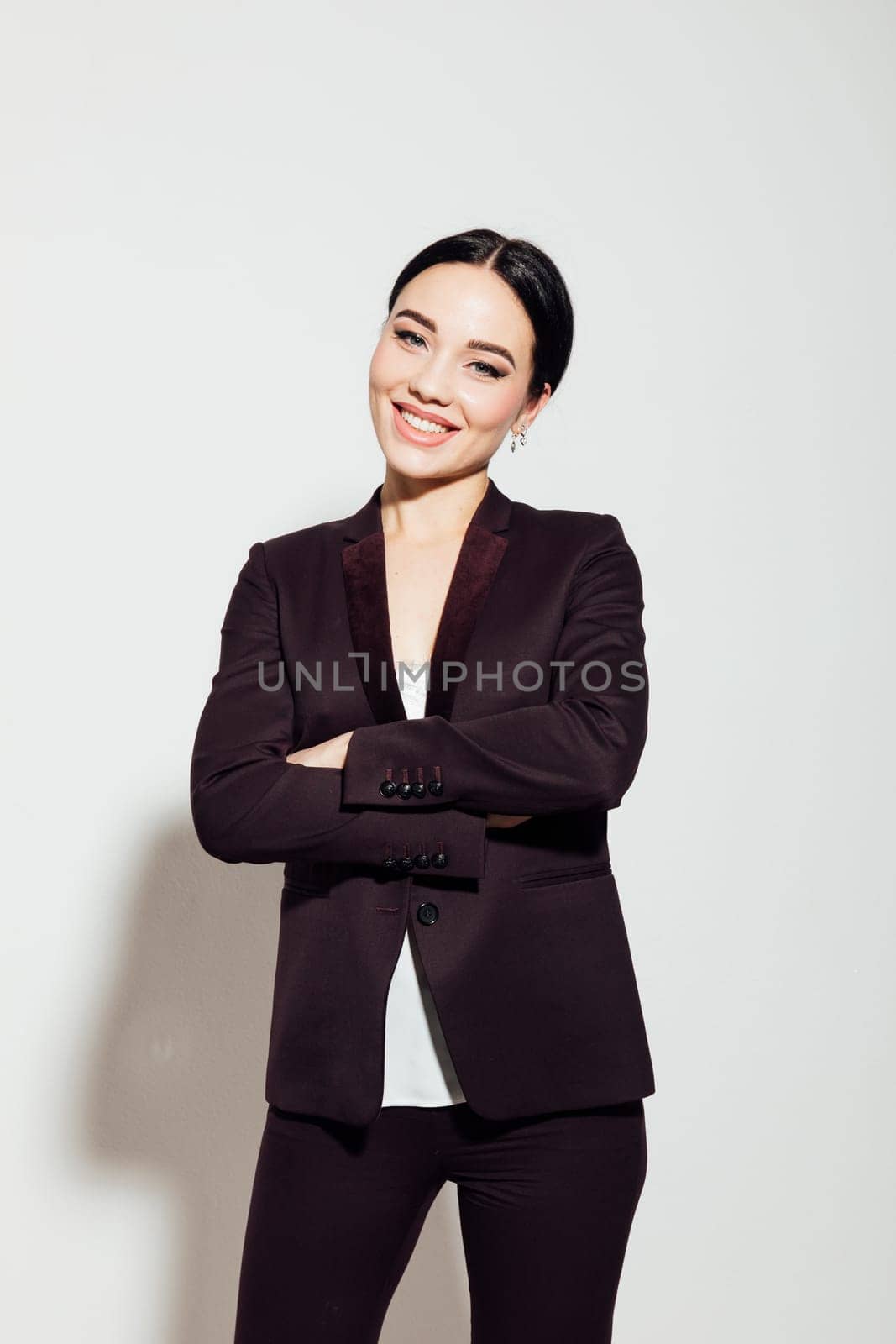 business woman at work in office stands in a business suit