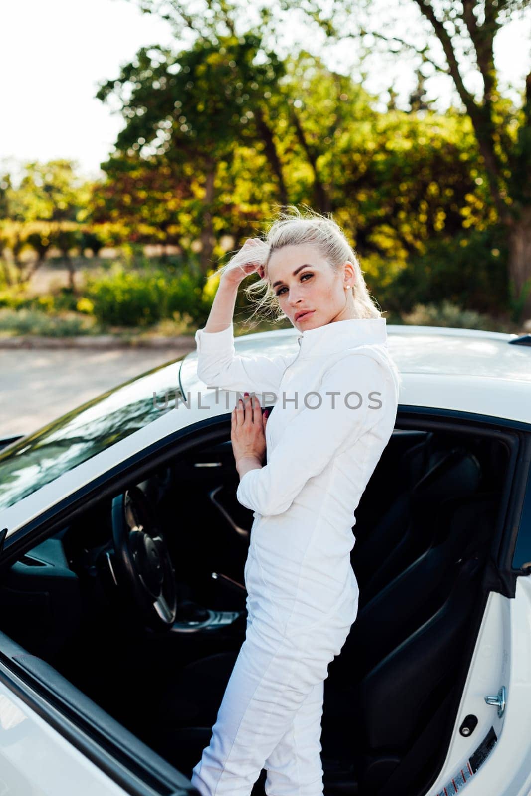 woman in traffic near a white car on a highway taxi driver