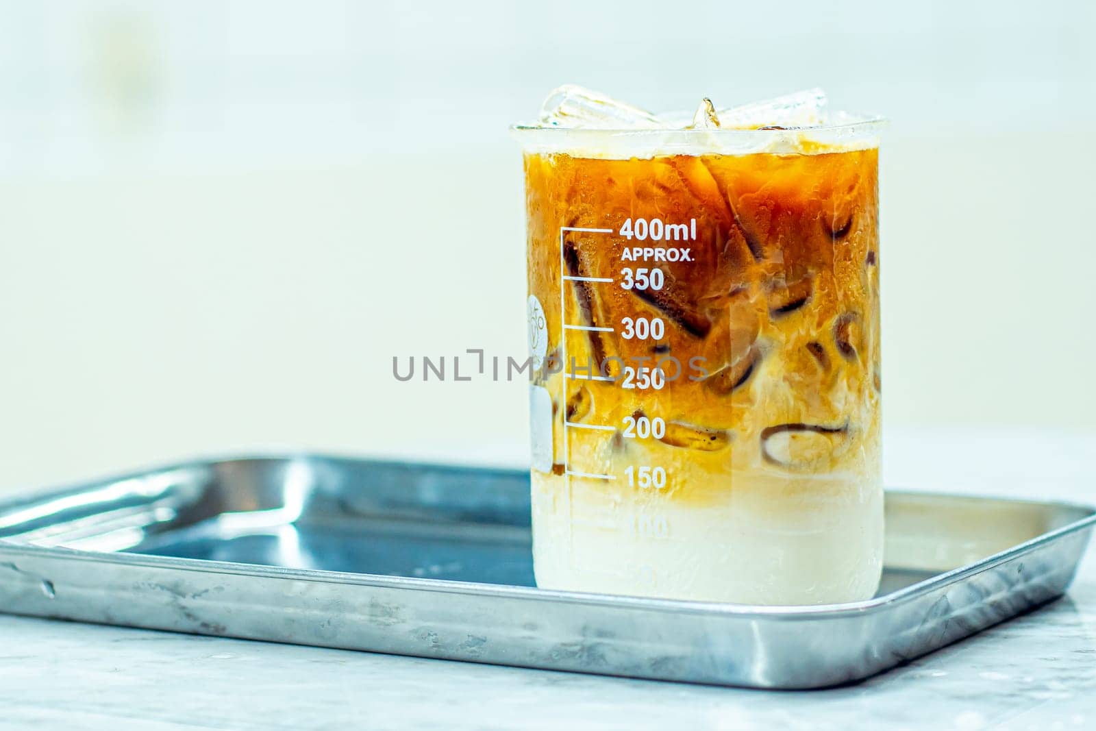 Brewed Brilliance: Savoring Iced Coffee in a Glass Beaker Mug