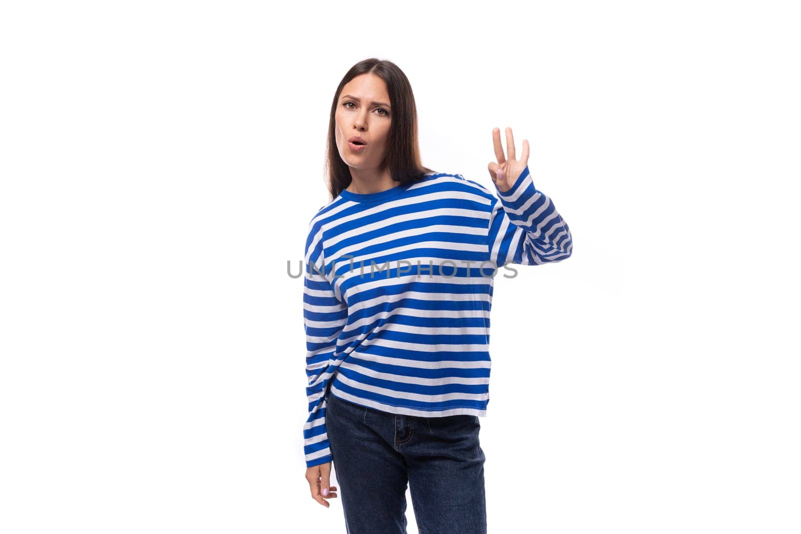 smart young stylish woman with straight hair dressed in a striped sweater by TRMK