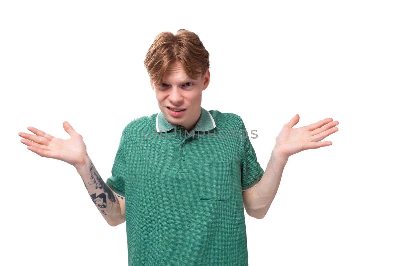 young european man with red hair and stylish hairstyle is having doubts and thinking about an idea.