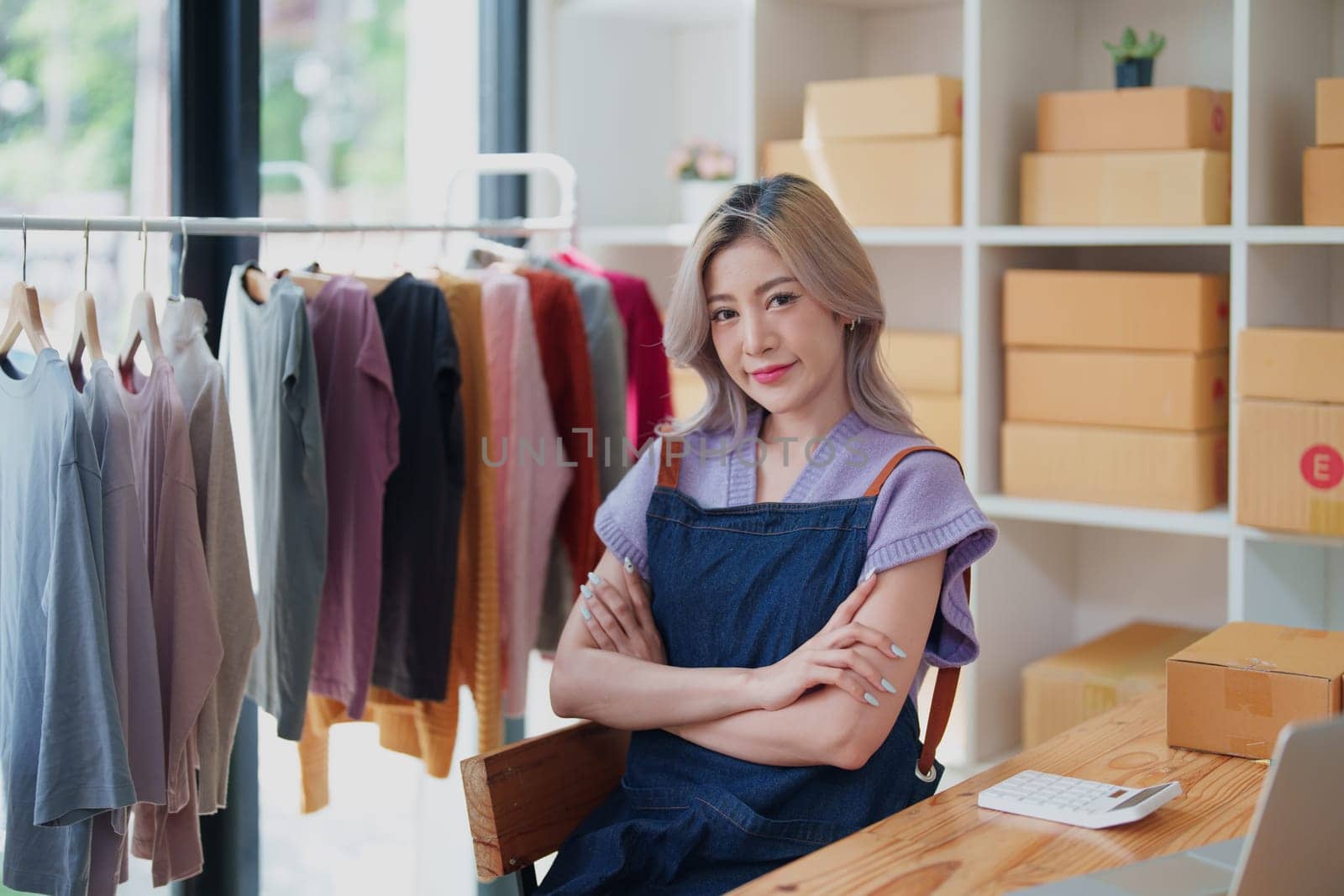 Portrait Of Asian Female Owner Of Fashion Store Clothing Store successful happy smile at small business, sme or ecommerce concepts.