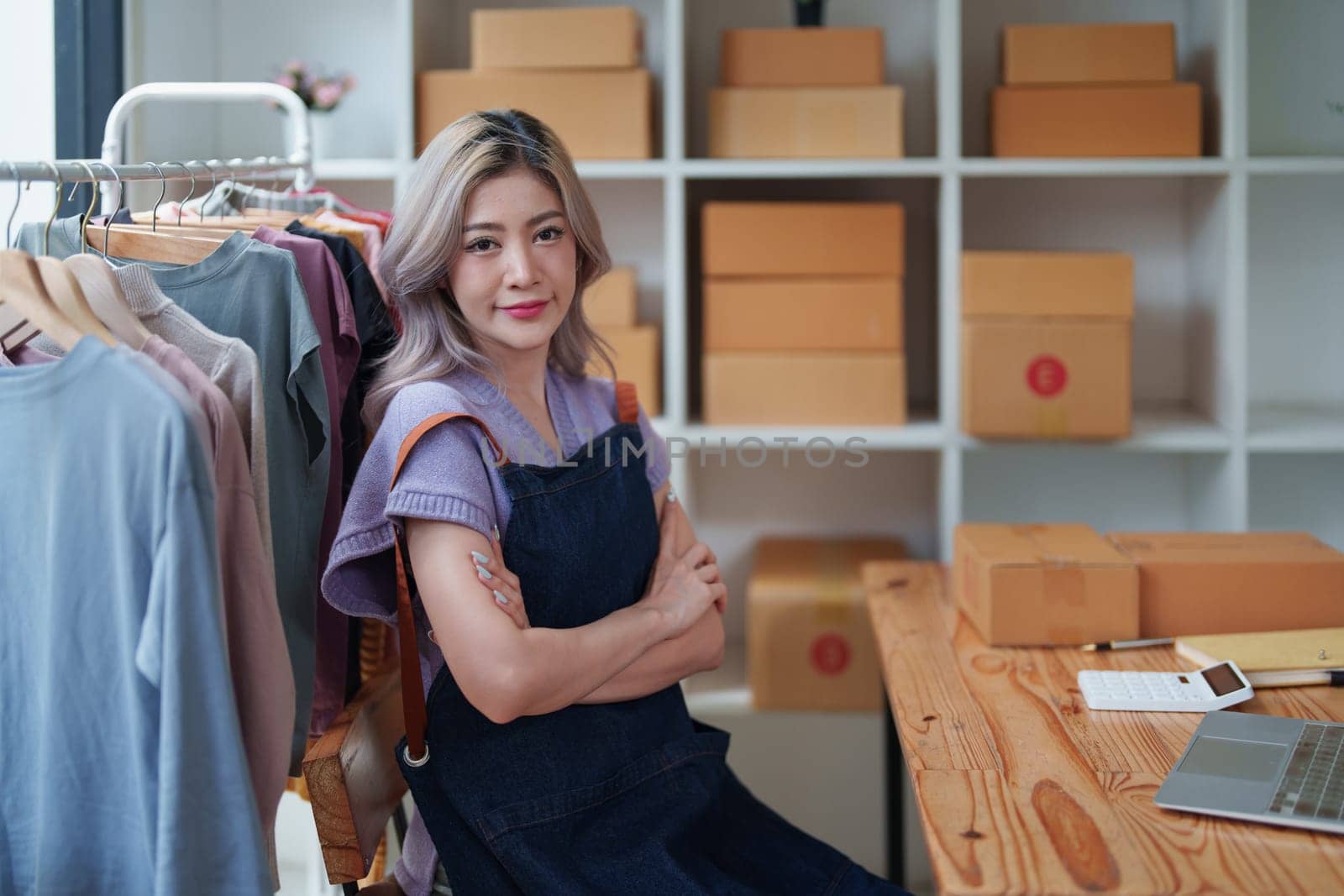 Portrait Of Asian Female Owner Of Fashion Store Clothing Store successful happy smile at small business, sme or ecommerce concepts.