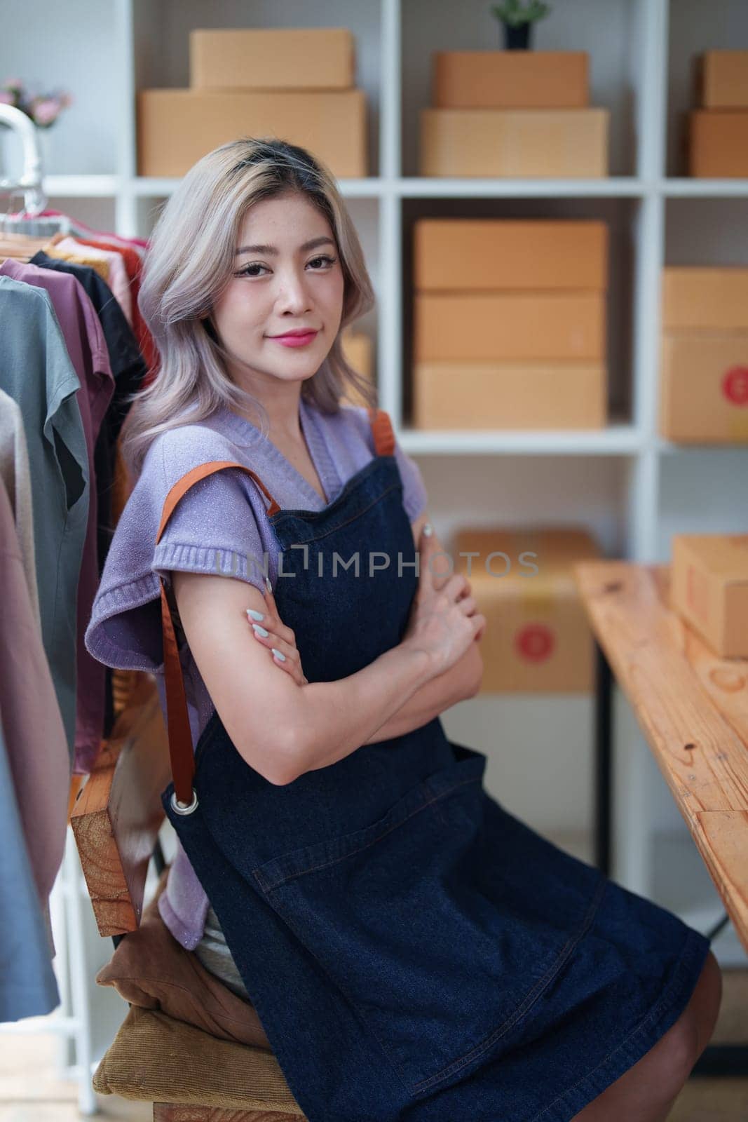 Portrait Of Asian Female Owner Of Fashion Store Clothing Store successful happy smile at small business, sme or ecommerce concepts by Manastrong