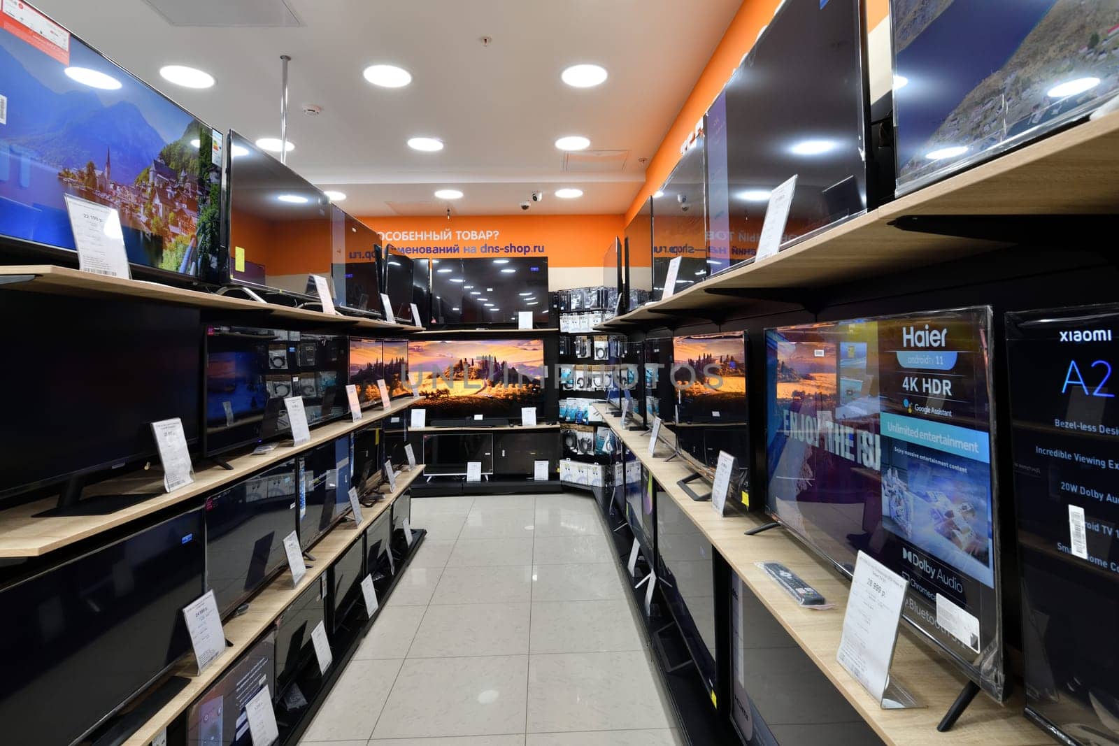 Moscow, Russia - Nov 11. 2023. TV in DNS network store selling household appliances in Zelenograd by olgavolodina