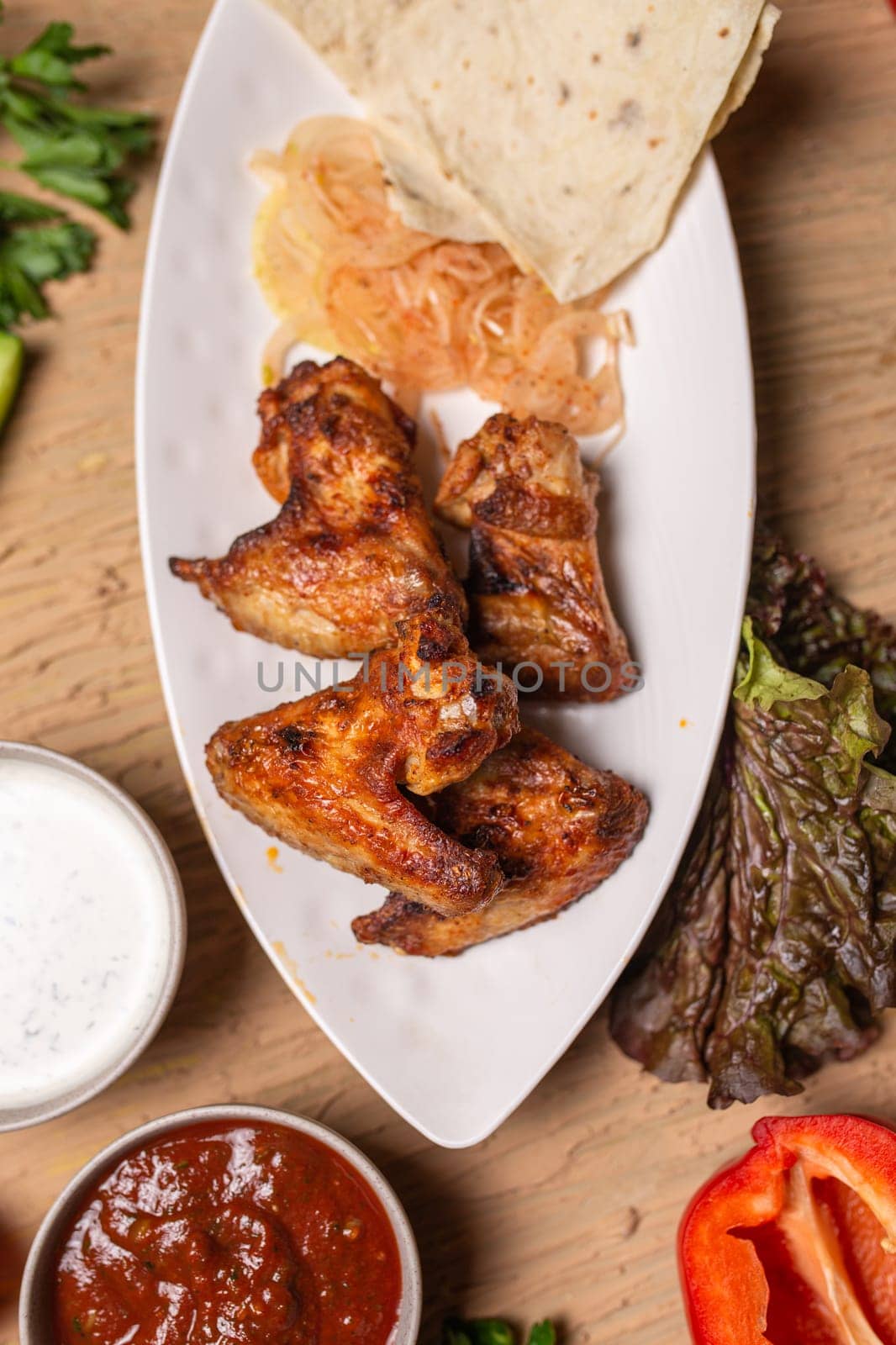 top view of chicken wings kebab. barbecue on the table in a cafe.