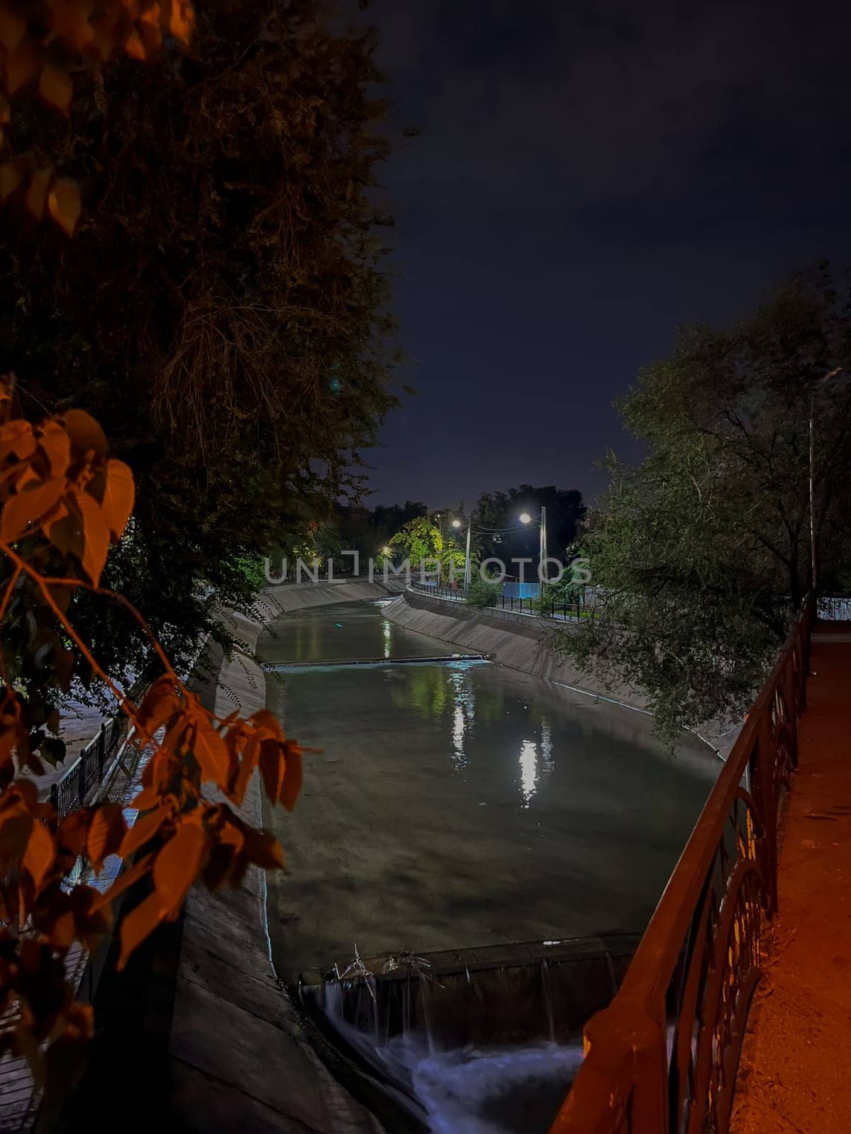 urban small river at night. photo at night on a smartphone.