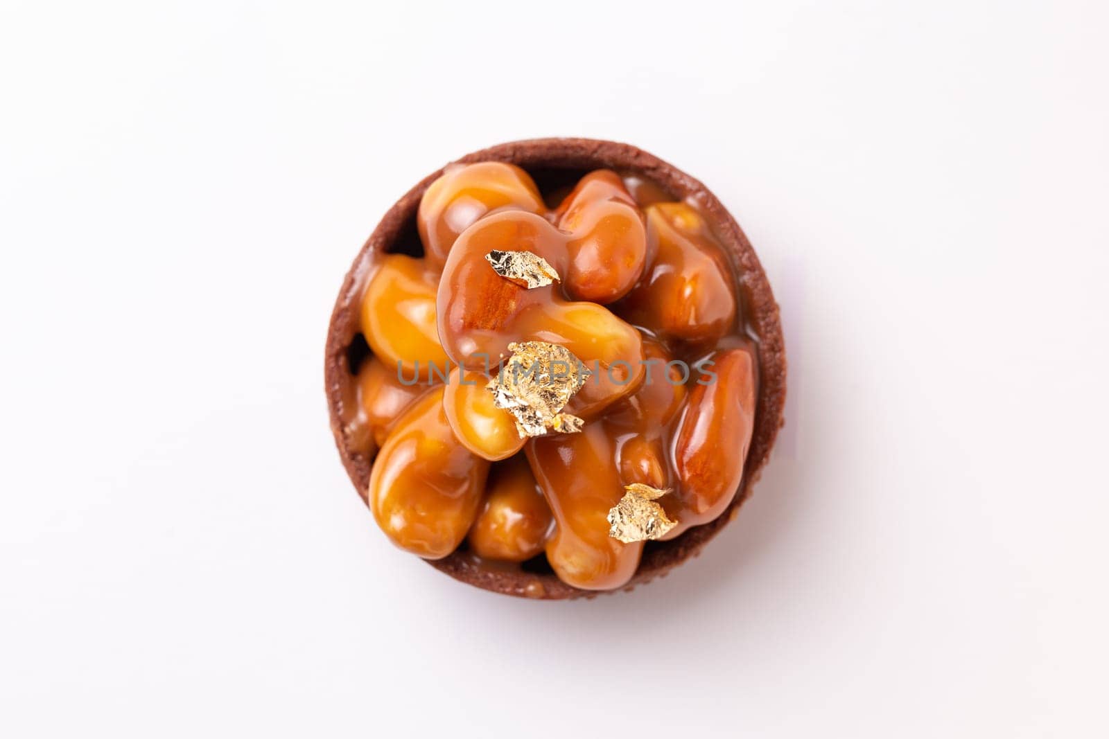 top view sweet dessert tartlet with nuts on a white background.