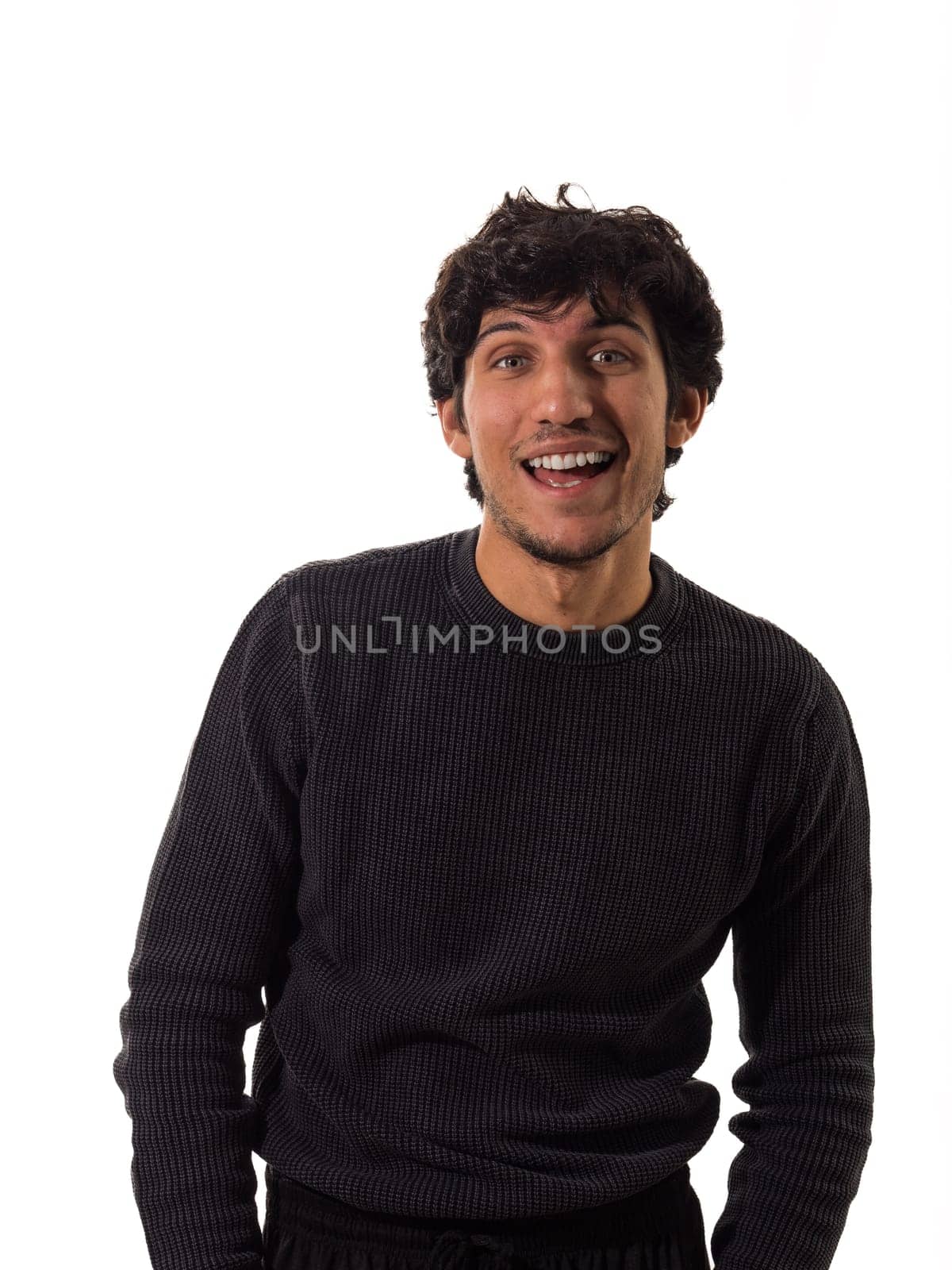 A man in a black sweater is smiling, isolated on white background in studio shot