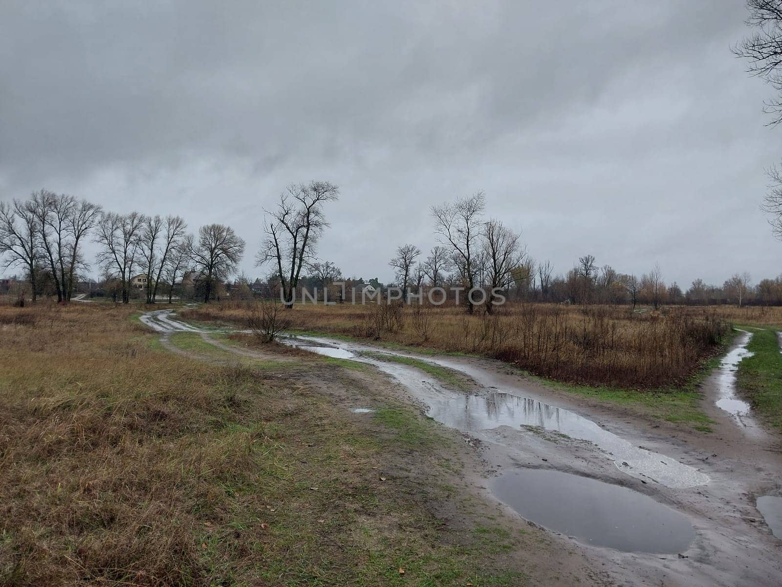 Blurred dirt roads in a village after rain by architectphd